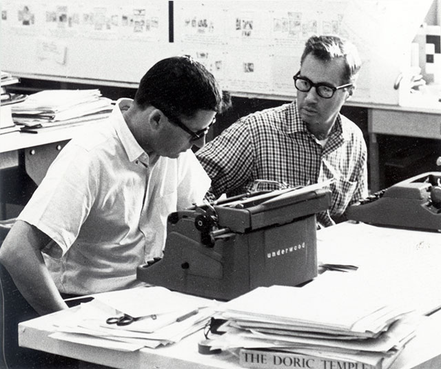 Glen Fleck (left), of the Eames Office, and Ralph Caplan (right) creating a puppet show for IBM circa 1960