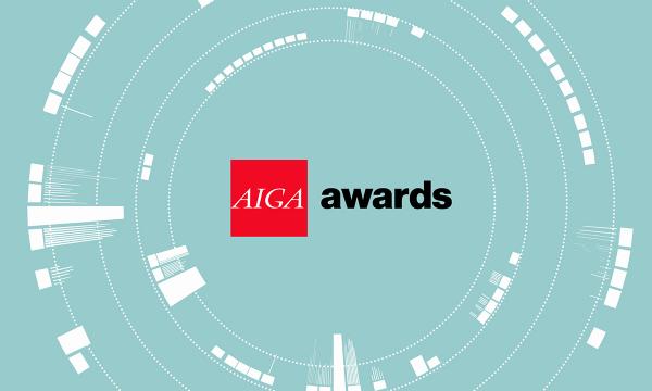 AIGA Awards logo lockup, AIGA letters in white inside a red square box followed by the word awards in lowercase black type against a light turquoise background with concentric white circles that resemble a camera lens.