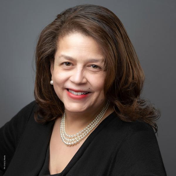 Portrait of Cheryl D. Miller wearing black top and white pearls © Olivier Kpognon