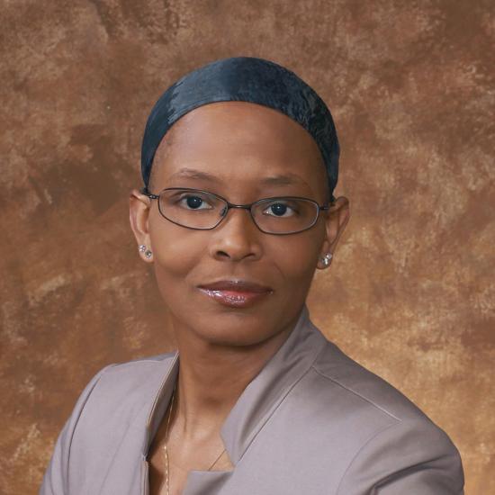 Headshot of Audrey Grace Bennett wearing a brown top. Image courtesy of Audrey Grace Bennett.